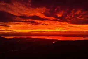 Santa Catarina Prints: Sunrise or sunset with amazing clouds and silhouette of coastline in Florianopolis, Brazil