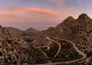 Sunrise in the Tramuntana mountains of Mallorca with a view of the landmark snake road leading down to Sa Calobra