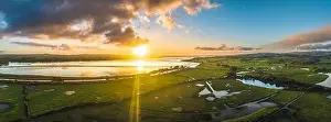 Rspb Prints: Sunrise over Wetlands and meadows in RSPB Exminster and Powderham Marshe from a drone