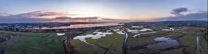Sunrise over Wetlands and meadows in RSPB Exminster and Powderham Marshe from a drone, Exeter, Devon, England