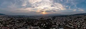 Sunset over Athens, Greece. Aerial drone wide panoramic view from Penteli mount