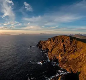 Sunset over the Atlantic Ocean and the cliffs of Bray Head on Valentia Island in County Kerry