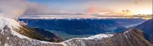 Sunset on the autumnal landscape of Scermendone Alp and Orobie Alps