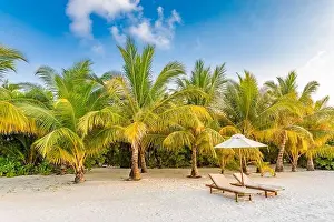 Sunset beach landscape, couple travel honeymoon destination. Luxury holiday summer vacation tropical island view close to sea. Loungers umbrella chair