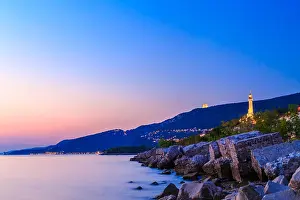 Trieste Prints: sunset at the beach below the lighthouse of Trieste, Friuli Venezia-Giulia, Italy