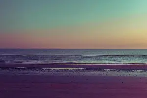 Heavens Prints: Sunset on the beach. Tinted photo in golden highlights