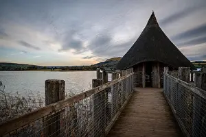 Sunset at a Beautiful natural lake in Brecon Beacons surrounded by rural farmland (Llangorse Lake, Wales)