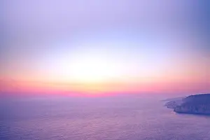 Sunset landscape with cliffs and amazing sunset sky in the north side of Zakynthos island, Greece