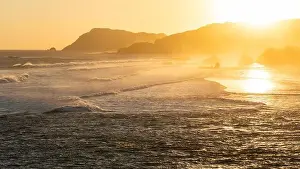 Layered Prints: Sunset landscape with huge waves and mountain hills on horizon