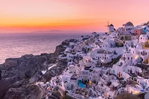 Cyclades Prints: Sunset night view of traditional Greek village Oia on Santorini island in Greece