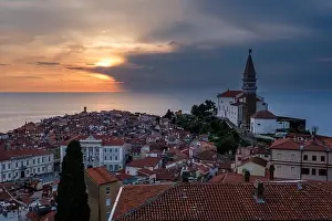 Seascapes Prints: Sunset over the old town with red-tiled roofs