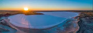 Pink Lake Prints: Sunset over salt lake in the desert - wide aerial panoramic landscape