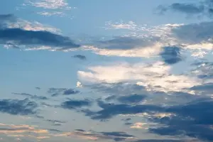 Time Lapse Prints: Sunset sky with golden rays of the sun against the background of silhouettes of mountain landscapes and rural villages