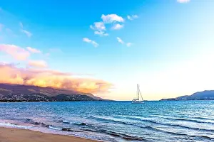 Sunset during summer on the island of Ilhabela with the sea and mountains around