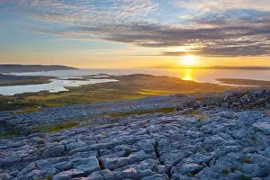 Gaelic Prints: Sunset over typical Burren landscape of fissured limestone pavement overlooking Galway Bay near Ballyvaughan