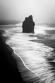 Gloomy Prints: Surf washes past an offshore reef and leaves beautiful streak patterns as the water moved back out to sea