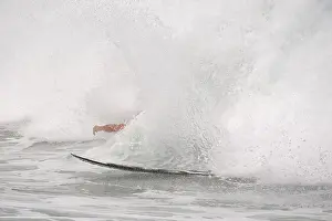 Surfer Prints: Surfer knocked by huge wave from surfboard