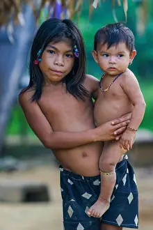 Surinam Prints: Surinam - Portrait of a girl with her baby brother of the Trio tribe in the Amazon village Tepu