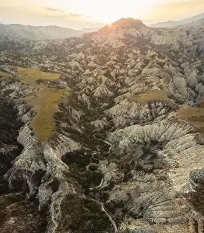 Surreal dramatic deserted earth landscape panorama with beautiful cliff formations