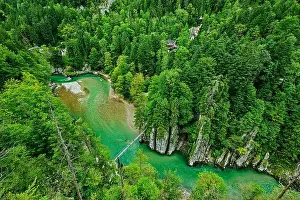 Suspension bridge leads over the Tiroler Ache river, Tiroler Ache, Chiemgau Alps, Tyrol, Austria
