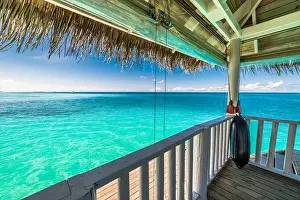 Swimming pool by the beach in Maldives. Luxury travel backgrund in mMaldives island. Blue sea and sky view