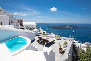 Images Dated 8th May 2019: Swimming poolside, infinity pool relaxation view out over the sea caldera of Santorini Greece