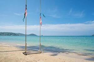 Images Dated 10th December 2017: Swing hang from coconut palm tree over summer beach sea in Phuket, Thailand