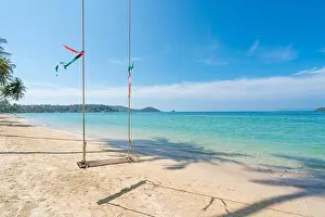 Swing hang from coconut palm tree over summer beach sea in Phuket, Thailand. Summer, Travel, Vacation and Holiday concept