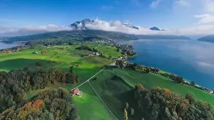 Rigi Prints: Switzerland aerial flight. Weggis city on the shore of Lake Lucerne. The top of Mount Rigi