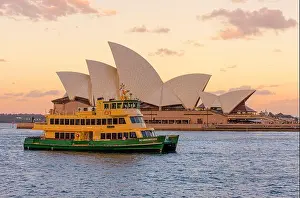 Sydney Harbour Prints: The Sydney Opera House at sunset with a Sydney ferry passing by on Sydney Harbour