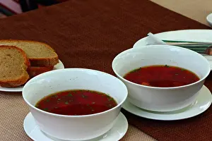 Beet Prints: on the table there are two plates of Ukrainian borsch
