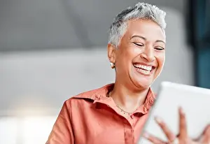 Scrolling Prints: Tablet, senior and business woman laughing in office at comic meme or joke on social media