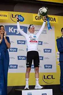 Motivate Prints: Tadej Pogačar on the podium in San Sebastian wearing the white jersey of the 2023 Tour de France