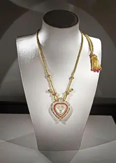 On White Prints: Taj Mahal heart pendant necklace photographed on a jewelry display bust with dramatic lighting