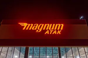 Food Market Prints: Taldykorgan Picturesque Magnum Atak Supermarket Billboard Orange Colored Neon Lights at Night