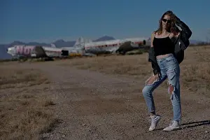 Tank Top Prints: A tall blonde teenage girl wearing ripped jeans