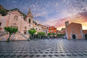 Taormina, Sicily, Italy. Cityscape image of picturesque town of Taormina, Sicily with main square Piazza IX Aprile and San Giuseppe church at sunrise