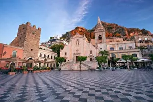 Taormina, Sicily, Italy. Cityscape image of picturesque town of Taormina, Sicily with main square Piazza IX Aprile and San Giuseppe church at sunrise