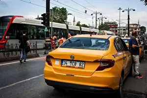 Urban City Prints: a taxi, parked in the busy streets of Istanbul, awaits the arrival of the next customer