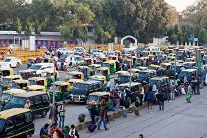 Rickshaw Prints: Taxis & auto rickshaws outside New Delhi Railway station, India