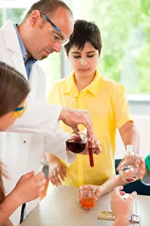 Pupils Prints: Teacher and pupils experimenting in chemical class