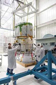 Inflatable Prints: Technicians move NASA's LOFTID re-entry vehicle to a turnover fixture for prelaunch processing inside Building 836