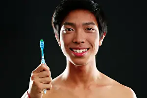 Gums Prints: Teeth care young man with toothbrush
