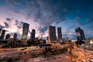 Tel Aviv Prints: TEL AVIV, ISRAEL - MARCH 1, 2019: Night Aerial view of tel aviv skyline with urban skyscrapers and blue sky