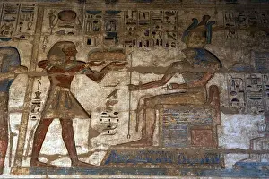 Offering Prints: Temple of Ramses III. The pharaoh making offerings to god Horus