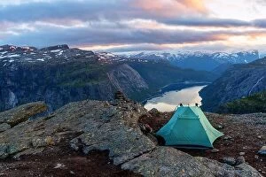 Images Dated 19th July 2017: Alone tent near Trolltunga rock - most spectacular and famous scenic cliff in Norway
