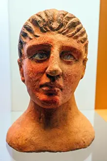 Ancient Art Prints: Terracotta male head with traces of red pigmentation from the votive deposit at the altar of the queen (4th - 3rd cent)