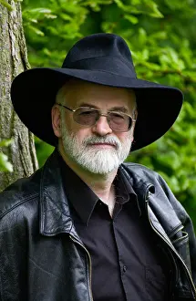 Alzheimers Prints: Terry Pratchett wearing his trademark black fedora hat pictured in countryside near Hay-on-Wye Powys Wales UK
