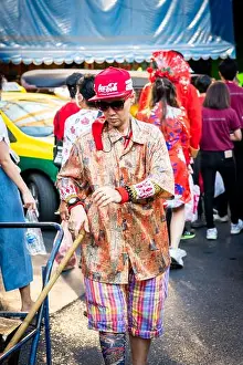 Chinese New Year Prints: A Thai market worker makes his way across the very busy Yaowarat Rd
