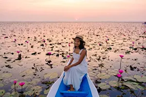 Lotus Prints: Thai women at the sea of red lotus